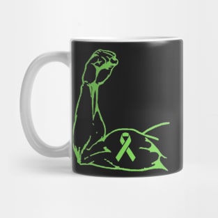 Flexed arm with a light Green Awareness Ribbon Mug